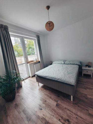 Postel nebo postele na pokoji v ubytování Apartament Eveline z garażem