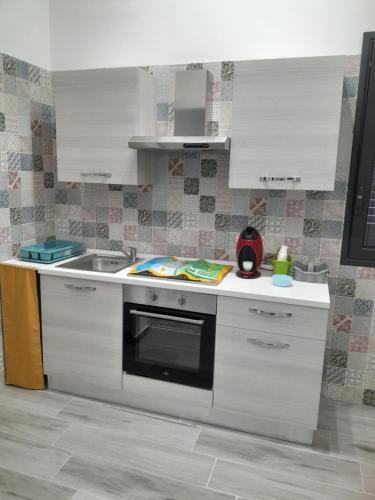 Kuchyň nebo kuchyňský kout v ubytování Casa vacanza La rosa dei venti