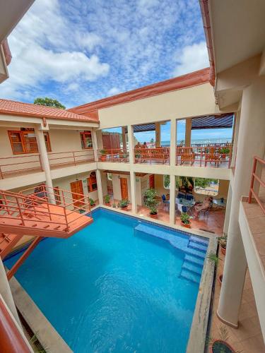 an aerial view of a hotel with a swimming pool at Seville Suite in San Juan del Sur