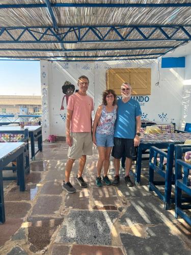 a group of three people standing in a room at Endo Mando in Shellal