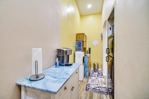 a kitchen with a blue counter top and a refrigerator at Pet Friendly, Hot Tub, 8ml to Beach, 7ml to Sebastian in Sebastian