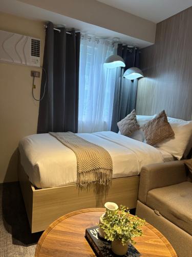 Cama o camas de una habitación en El Suite