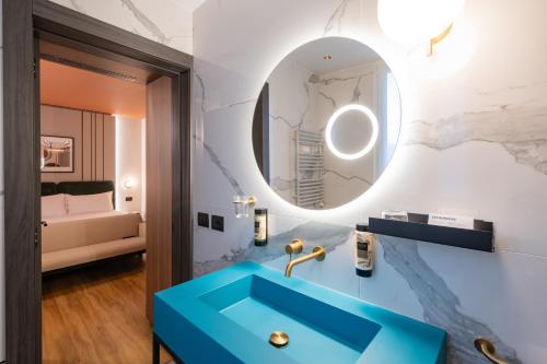 Postel nebo postele na pokoji v ubytování Bleis Hotel