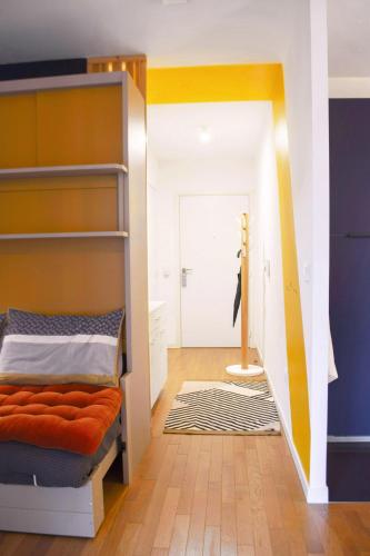 a bedroom with a bunk bed and a hallway at SweetHomeVersailles 10mn walk from Palace in Versailles