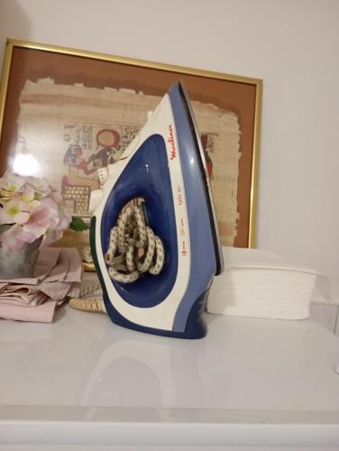 a blue and white toaster sitting on a shelf at Nataly Apartment in Belgrade