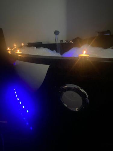 a bathroom with a blue light in a room at VILLA MANIVA in Ginosa Marina