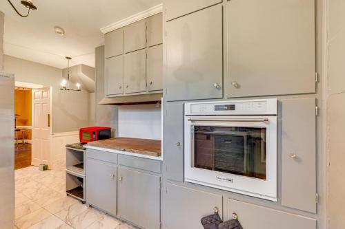a kitchen with white cabinets and an oven at Wilson Family Home Walk to Community Rec Center! in Wilson