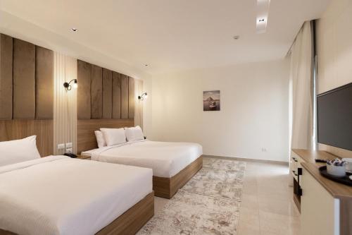 Ένα ή περισσότερα κρεβάτια σε δωμάτιο στο Mazar Pyramids Hotel