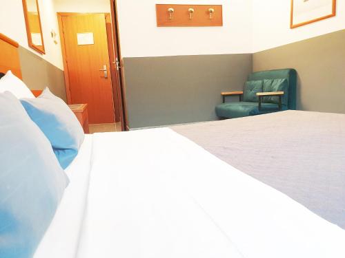 Кровать или кровати в номере Hotel Vitruvio