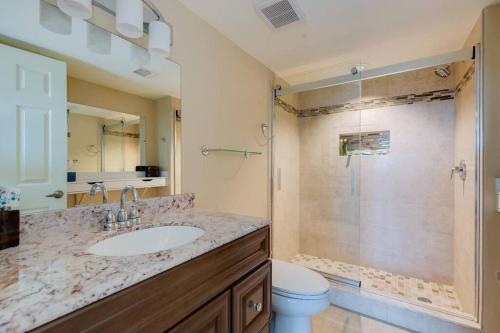 a bathroom with a sink and a shower at Toes in the Sand - 2 Bedroom Condo Sleeps 4 in Tavernier