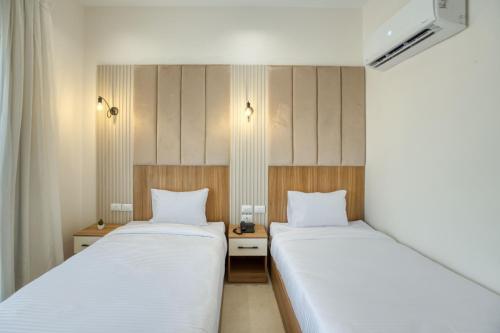Ένα ή περισσότερα κρεβάτια σε δωμάτιο στο Mazar Pyramids Hotel