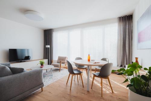 a living room with a table and chairs at Byt K21 Na Perštýně in Liberec