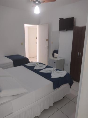 Katil atau katil-katil dalam bilik di Hotel Portal da Praia