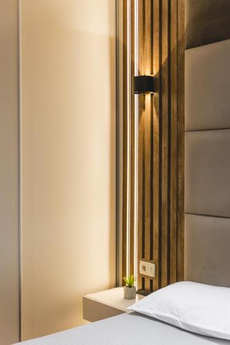 a bedroom with a bed and a window at Harmony Apartments in Podgorica