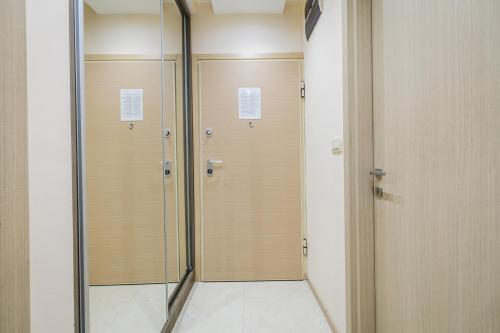 a row of lockers in a locker room with a mirror at Harmony Apartments in Podgorica