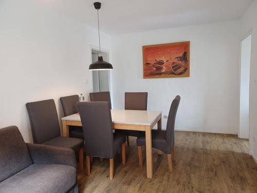 a dining room with a table and chairs at Ferienwohnungen Am Storchennest in Krembz bei Gadebusch in Krembz