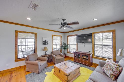 a living room with a couch and a tv at The Bird Cabin Peaceful Refuge in East Texas in Ben Wheeler