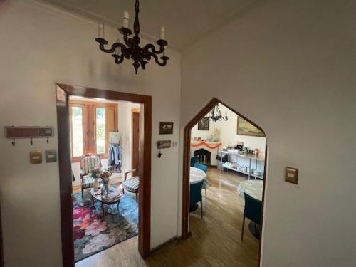 a living room with a mirror and a dining room at Casa Torino in Santiago