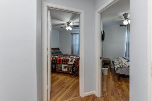 a bedroom with a bed and a ceiling fan at 7 minutes to IAD upstairs room in DC Metro area Middle size room in Sterling