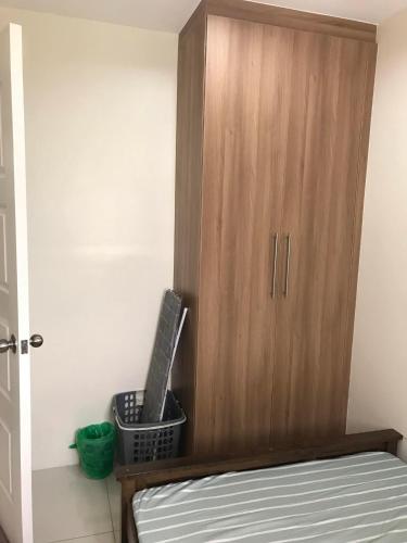 Ένα ή περισσότερα κρεβάτια σε δωμάτιο στο 1-BR Condo unit in Mandaue City for Rent - The Midpoint Residences