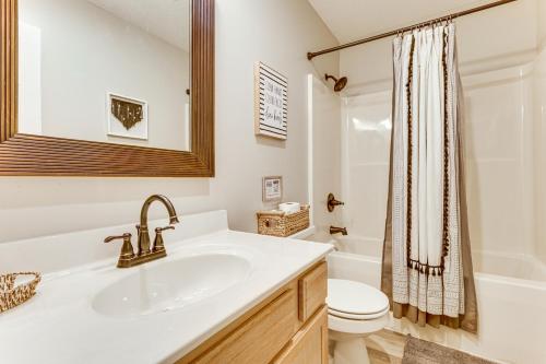 a white bathroom with a sink and a toilet at Home Less Than 2 Mi to Mtn Greens Golf, Massanutten Ski! in McGaheysville