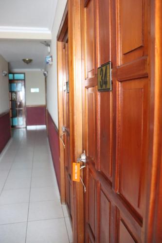 a door with the number on it in a hallway at Hotel Toledo in David