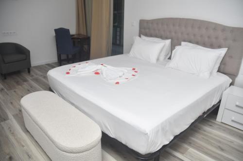 Postel nebo postele na pokoji v ubytování Hotel Cantinho