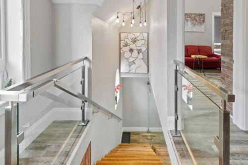 a staircase in a home with white walls at ENTIRE BACHELOR UNIT EN-SUITE ACROSS FROM GOOGLE - br4 in Kitchener
