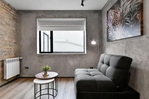 a living room with a couch and a table at Nova Apartments in Bogotá