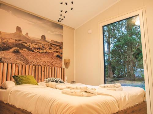 Postel nebo postele na pokoji v ubytování Modern holiday home with terrace