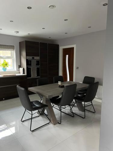 a dining room with a wooden table and chairs at Holiday Home in Leap in Leap