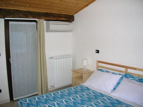 Postel nebo postele na pokoji v ubytování B&B Al Carotin