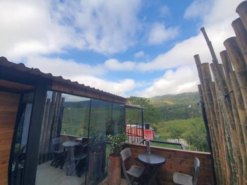 a balcony of a house with a view of the mountains at Hotel & restaurante campestre la siria in San Juan de Rioseco 