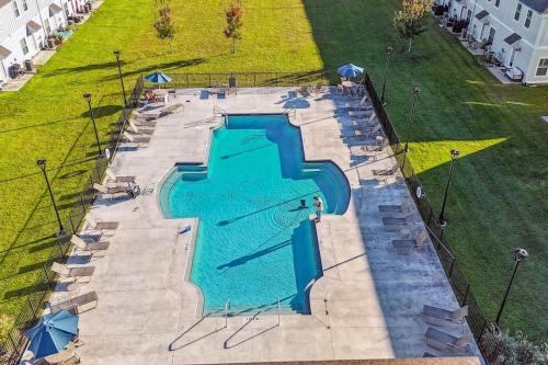an overhead view of a swimming pool in a park at LUXURY TOWNHOME NEAR DOWNTOWN AND PENSACOLA BEACH in Pensacola