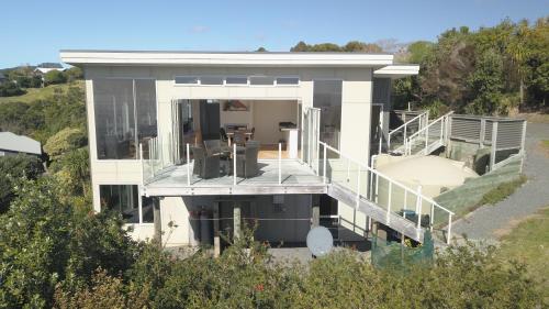 an aerial view of a house with a balcony at The Wow House in Kuaotunu