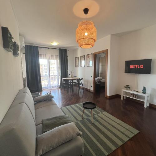 a living room with a couch and a table at Mamma Mia House Fiumicino in Fiumicino Airport
