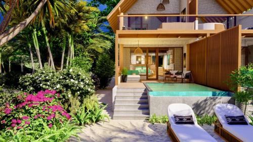 a villa with a swimming pool and a house at Island Luxury Retreat - Maalhos in Maalhos