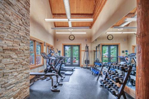a gym with treadmills and exercise bikes at Mountain Lodge Telluride in Telluride