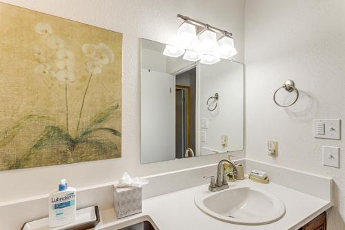 a bathroom with a sink and a mirror at Walk to Ski Lifts Cozy Crested Butte Condo in Crested Butte