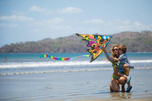 two people on the beach with a kite at Villa #35 - Blue Venao, Playa Venao in Playa Venao