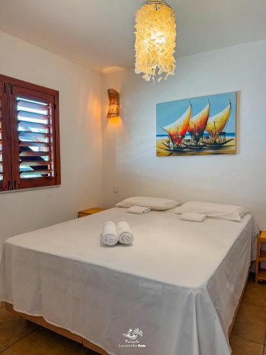Katil atau katil-katil dalam bilik di Pousada Icaraizinho Praia
