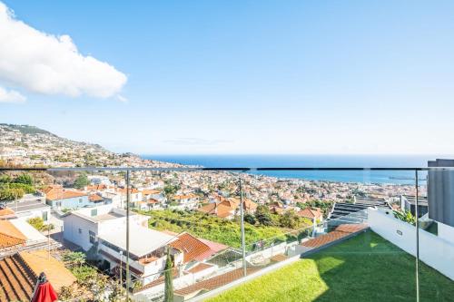 a view of a city with the ocean in the background at Bayview Villa Retreat in Funchal