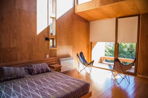 Posezení v ubytování Casa moderna en el bosque
