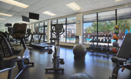 a gym with several treadmills and exercise bikes at Holiday Inn Nashville - Vanderbilt - Dwtn by IHG in Nashville