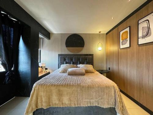 a bedroom with a large bed in a room at Apto de lujo con jacuzzi in Santa Rosa de Cabal