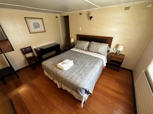 Giường trong phòng chung tại Hostal Sevilla Temuco