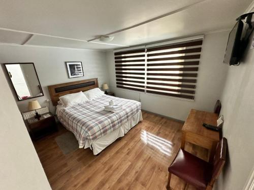 Giường trong phòng chung tại Hostal Sevilla Temuco