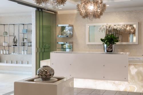 a room with a chandelier and a white counter at JW Marriott Los Angeles L.A. LIVE in Los Angeles