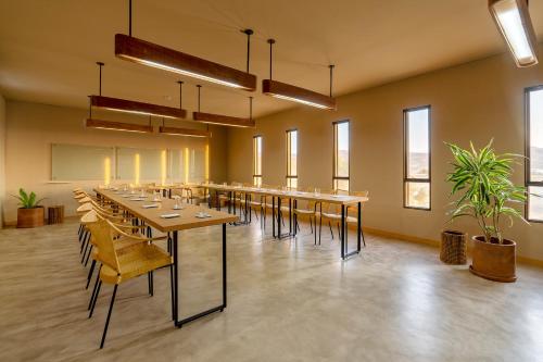 a large room with a long table and chairs at Norte Suites Boutique in Los Órganos