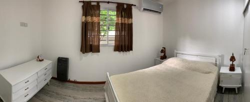 Katil atau katil-katil dalam bilik di Apartamentos Colibrí